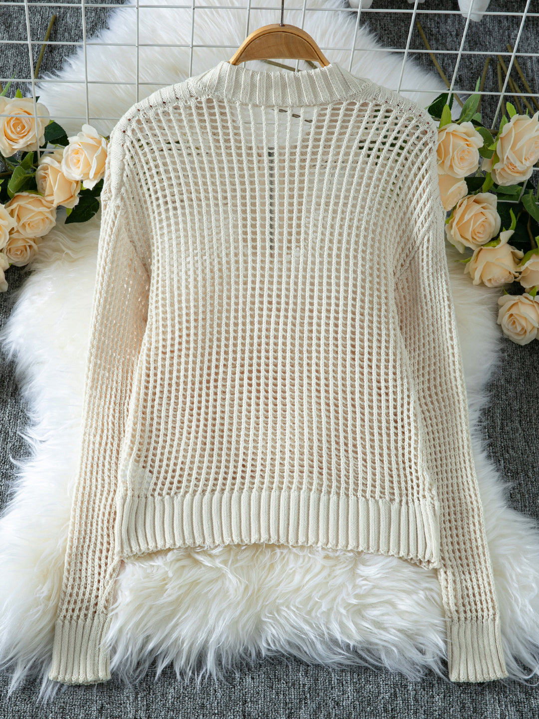 Half-zip hollow knitted sweater