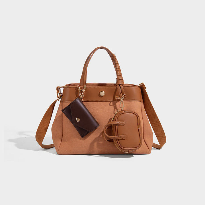 Large capacity simple hand-held commuting shoulder bag