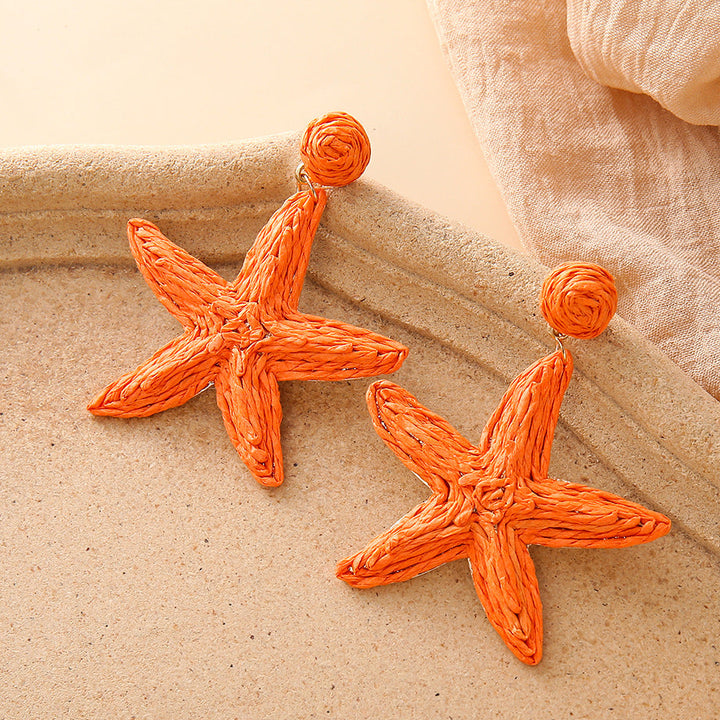 Boho hand-woven starfish earrings for seaside vacation