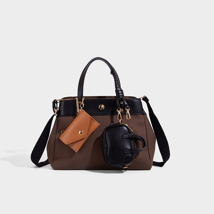 Large capacity simple hand-held commuting shoulder bag