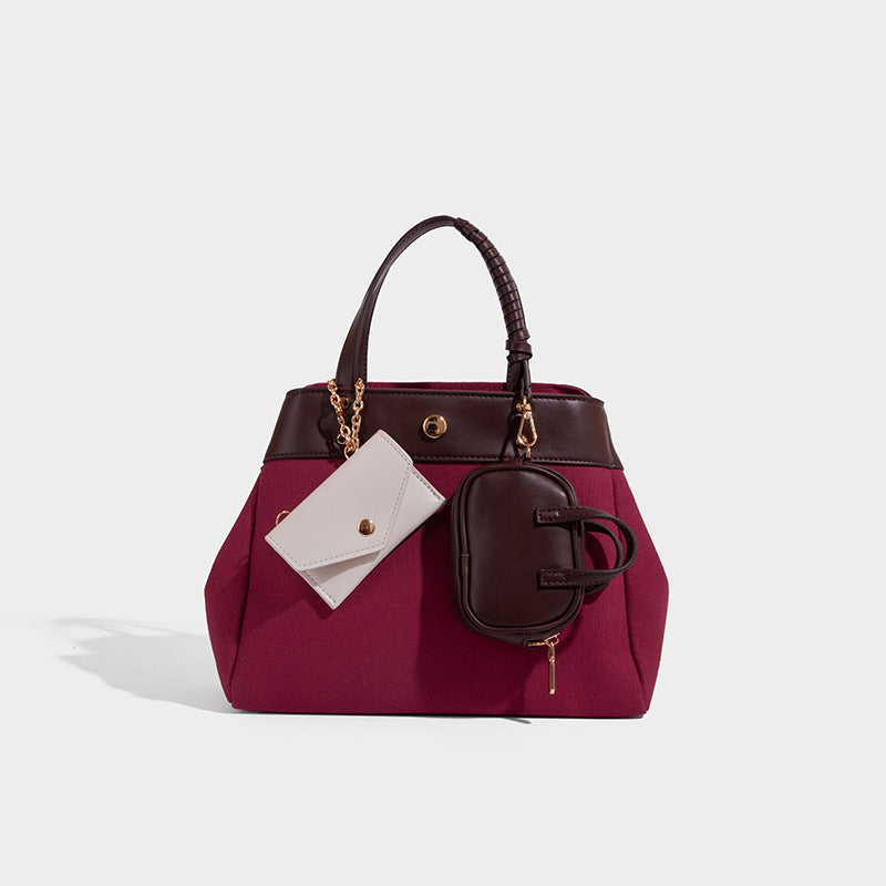 Large capacity simple hand-held commuting shoulder bag