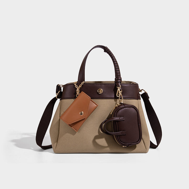 Large capacity simple hand-held commuting shoulder bag