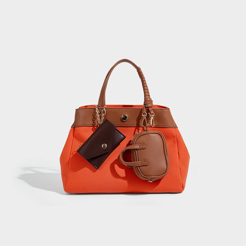 Large capacity simple hand-held commuting shoulder bag